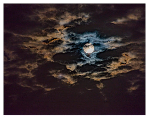 "Full Moon behind Clouds”